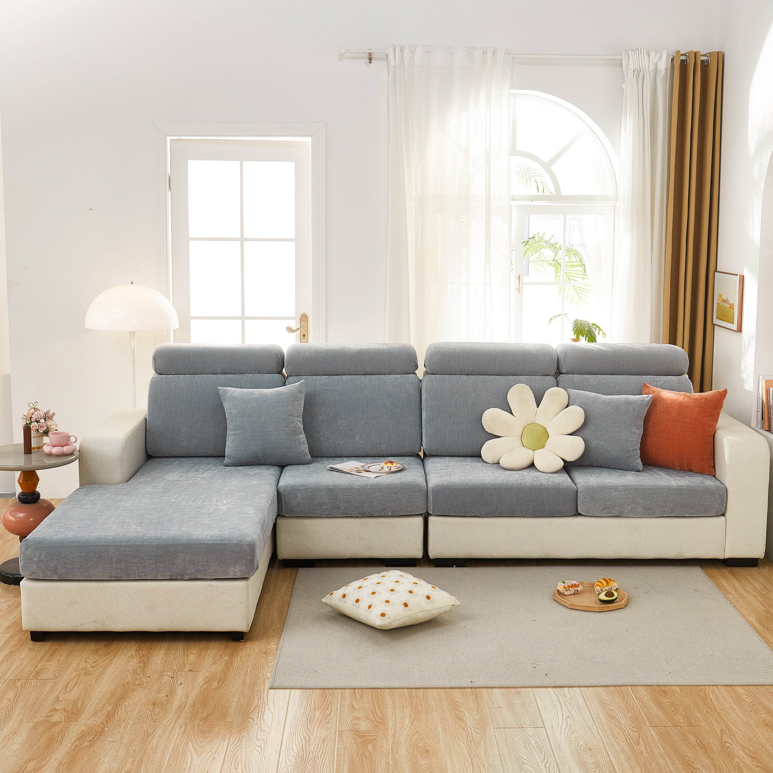 Full dark gray sofa cover tightly fitted over a fabric couch, blending into a warm, pet-friendly living room