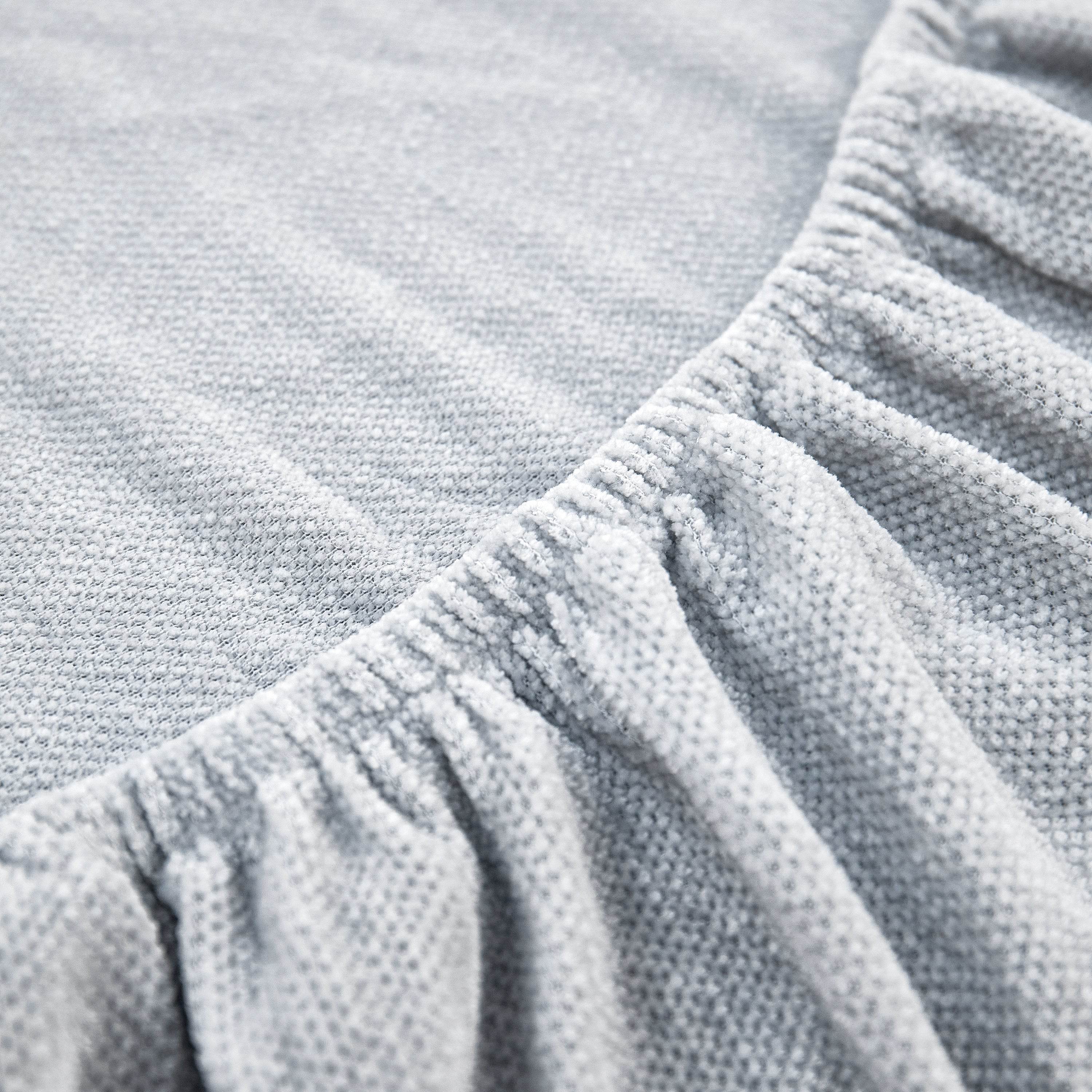 Chenille fabric catching soft light, highlighting its textured surface and premium feel