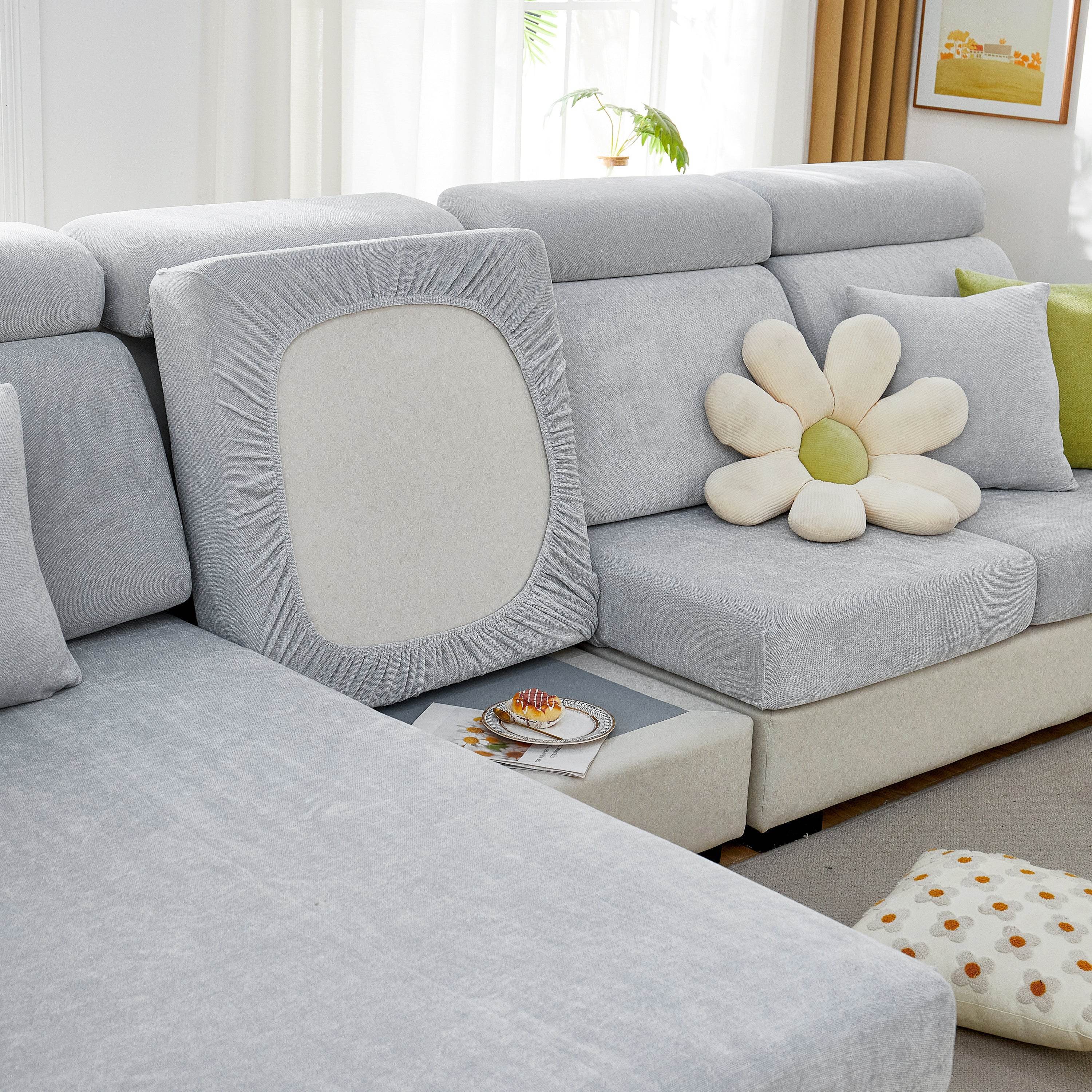 Chenille slipcover stretched snugly over sofa for a smooth, tailored fit with no slipping or bunching