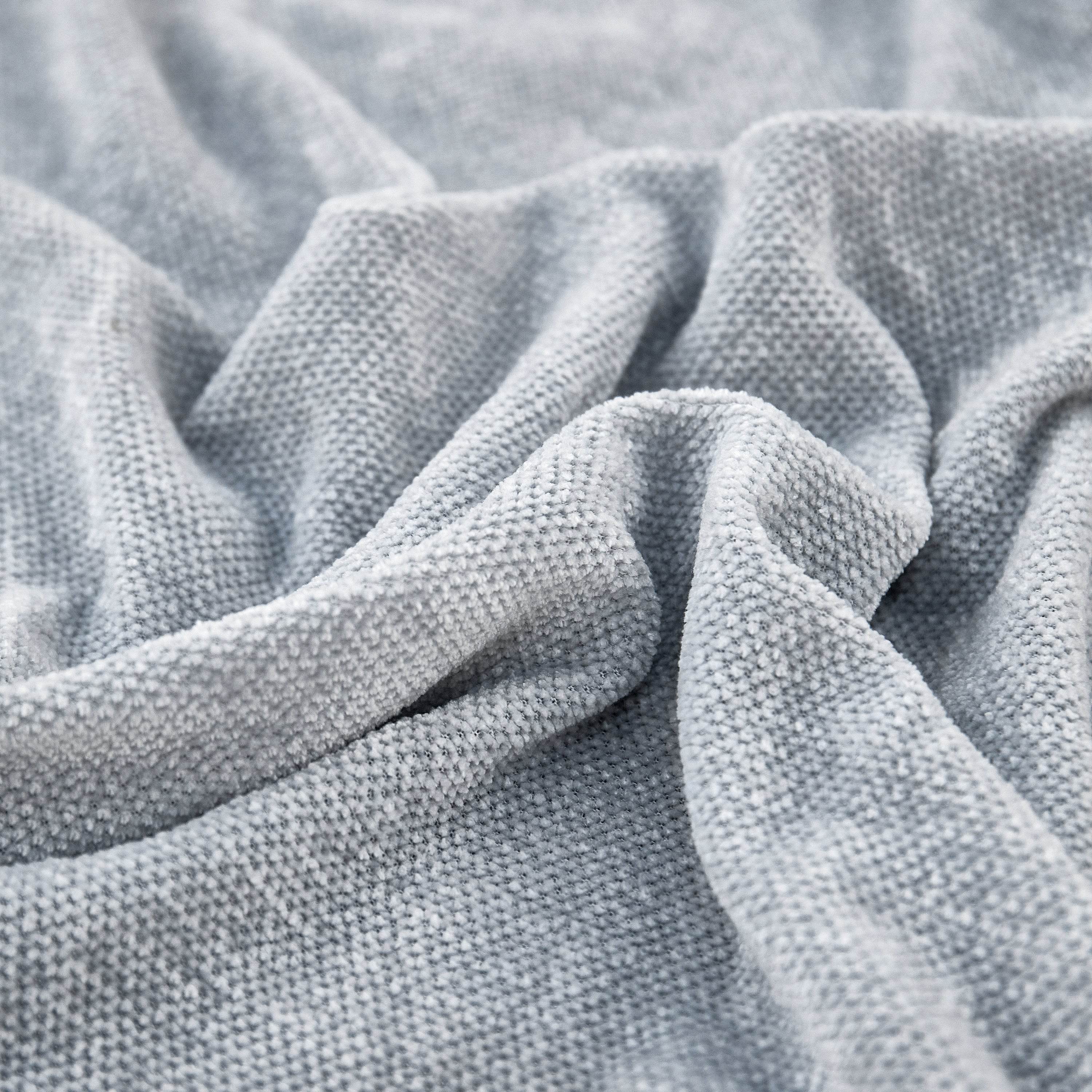 Close-up of soft, textured chenille fabric with visible weave pattern and rich surface detail