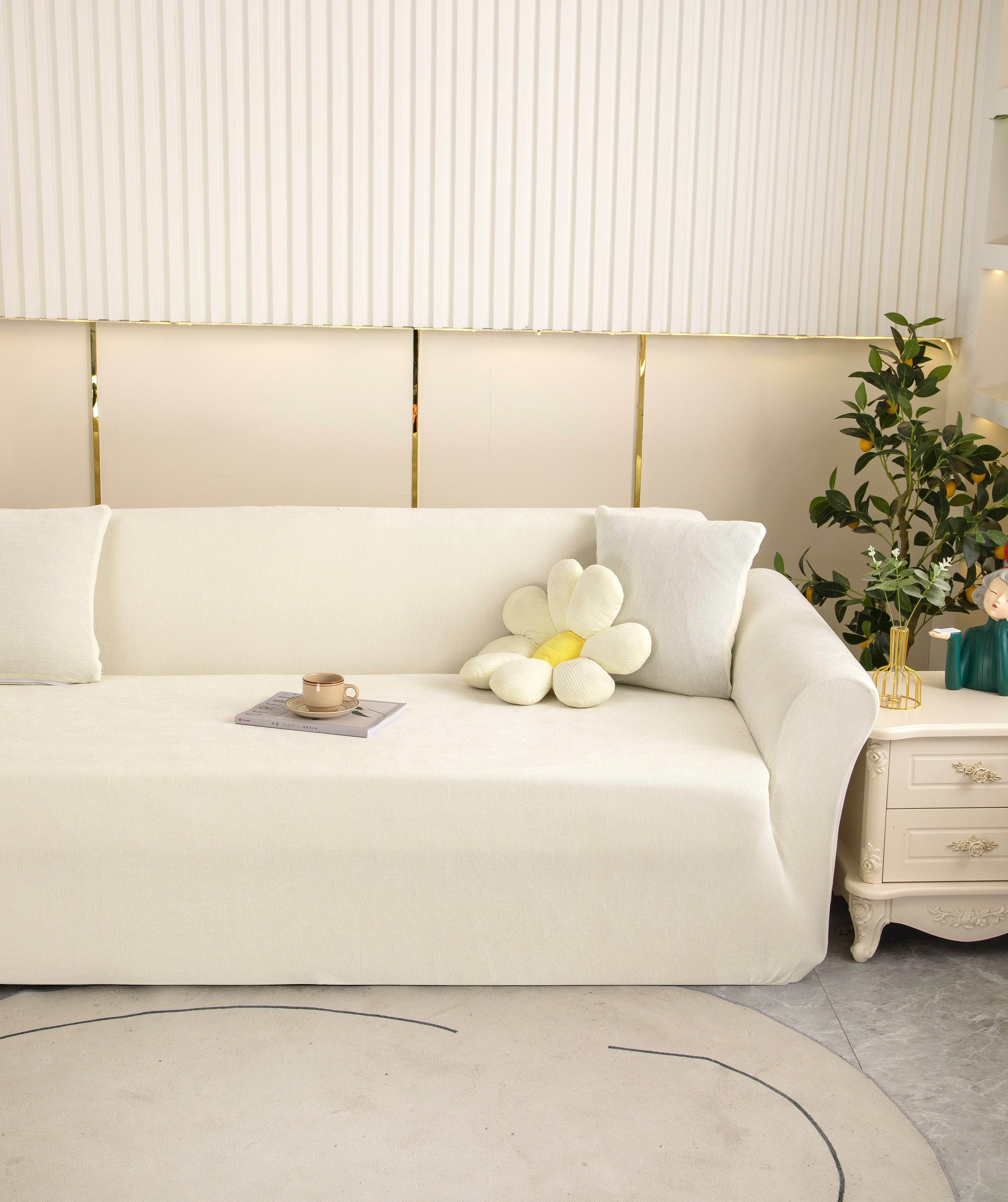 Ultra-soft Cozee Chenille sofa slipcover in cream, fitted on a 3-seater couch