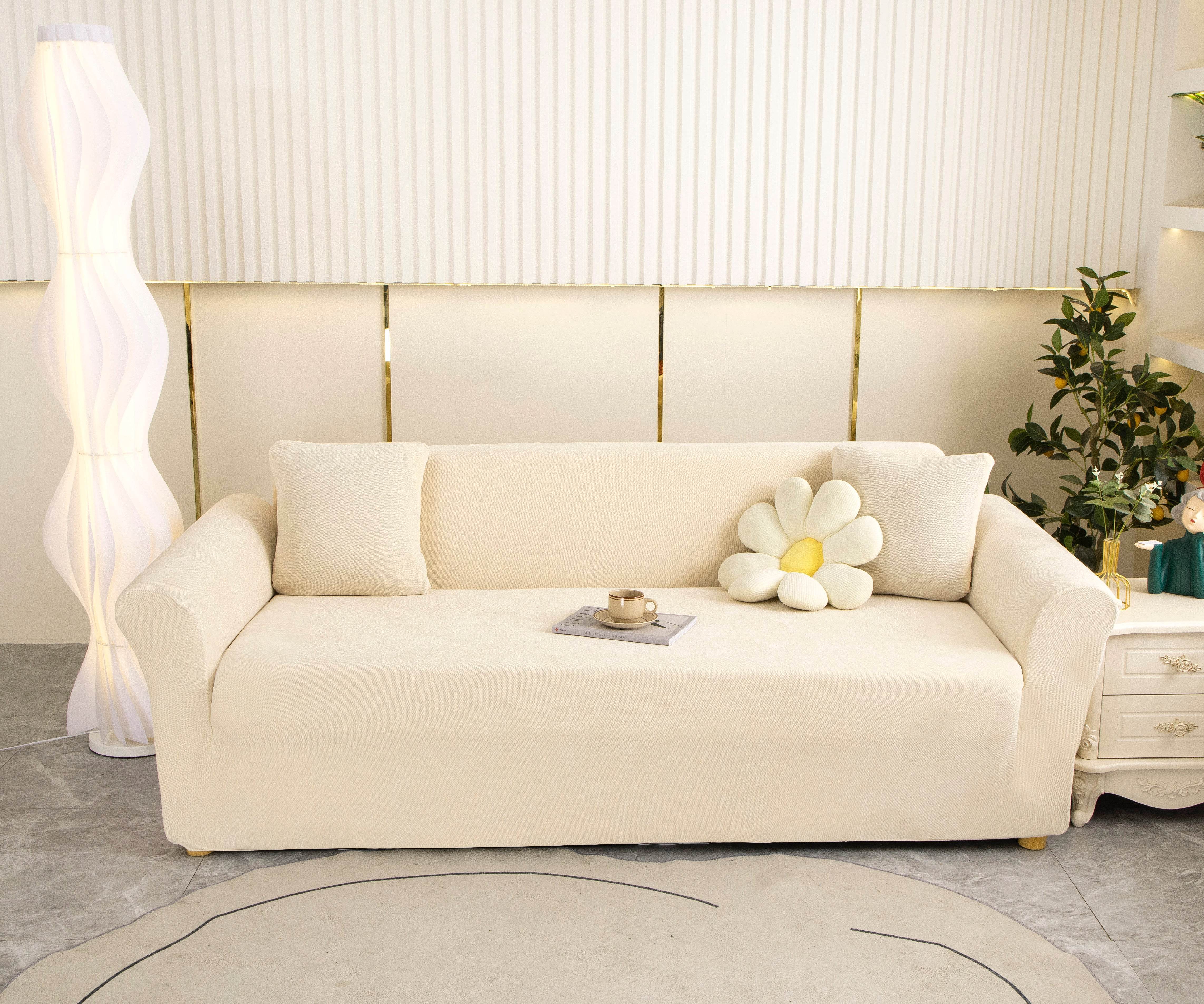 Full view of beige Cozee Chenille slipcover fitted on a 3-seater sofa in a bright living room