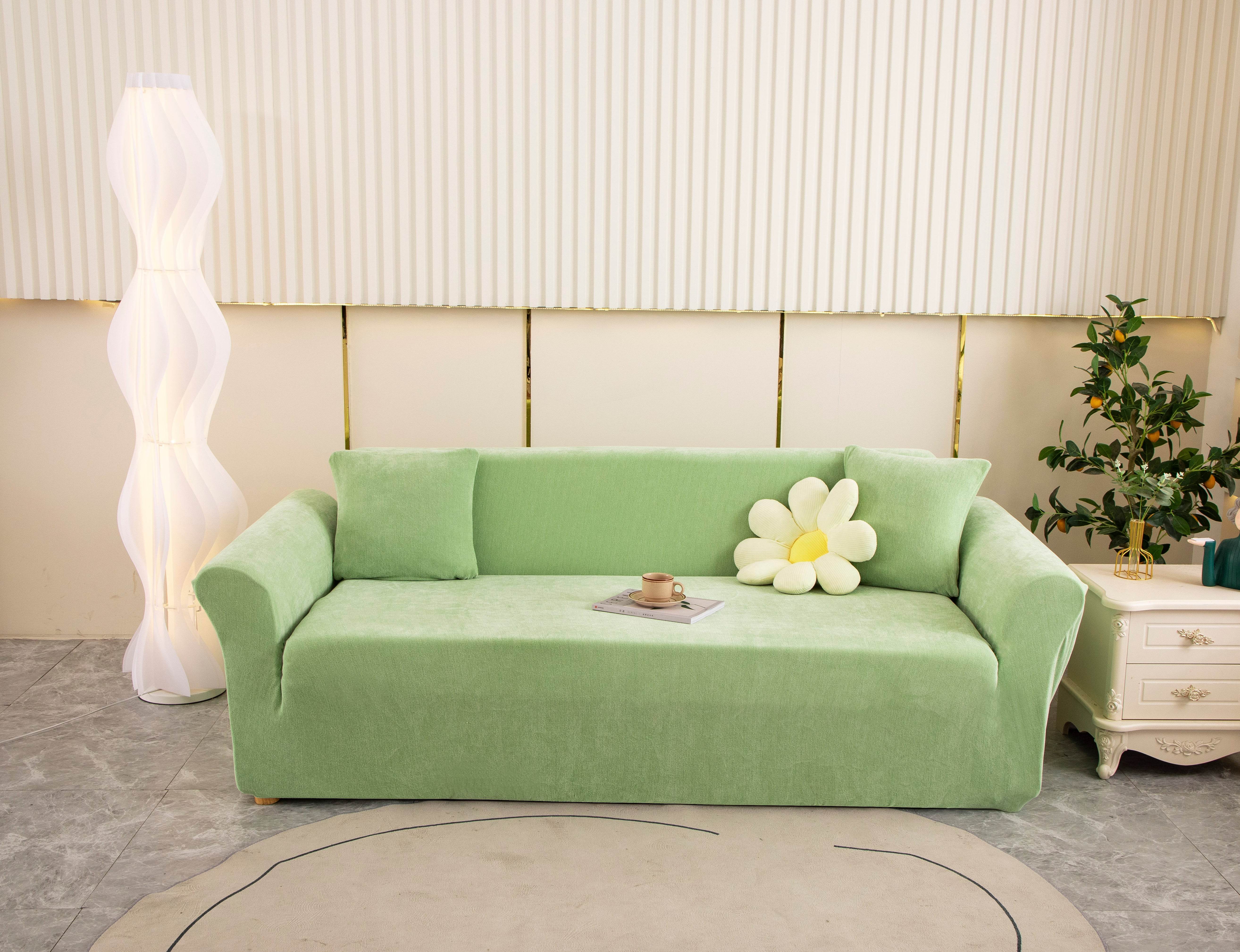 Full view of mint green Cozee Chenille slipcover fitted on a 3-seater sofa in a bright living room