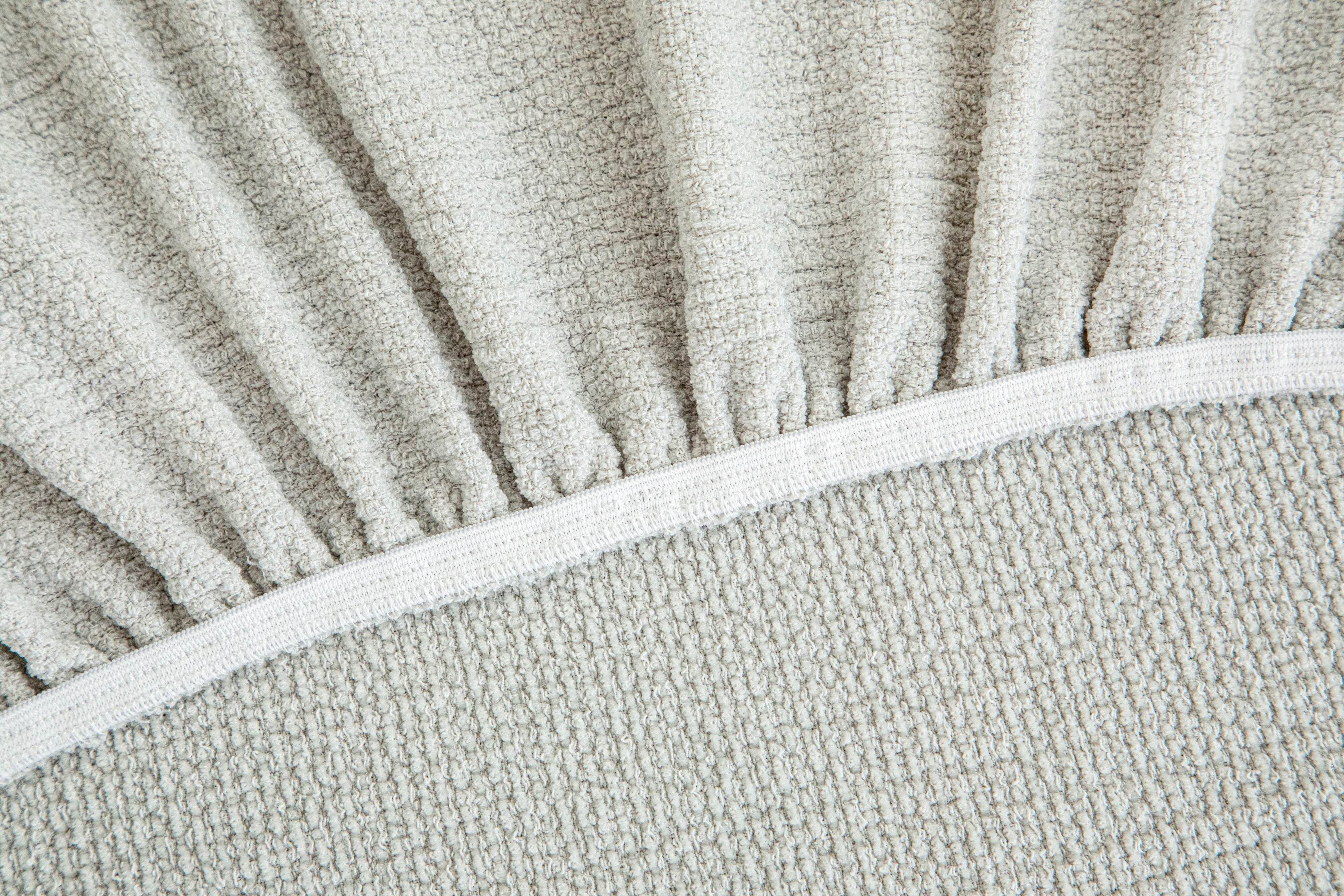 Seam detail of the Cozee Chenluxe Sofa Cover, showing reinforced stitching, durable seam construction, and premium finishing.