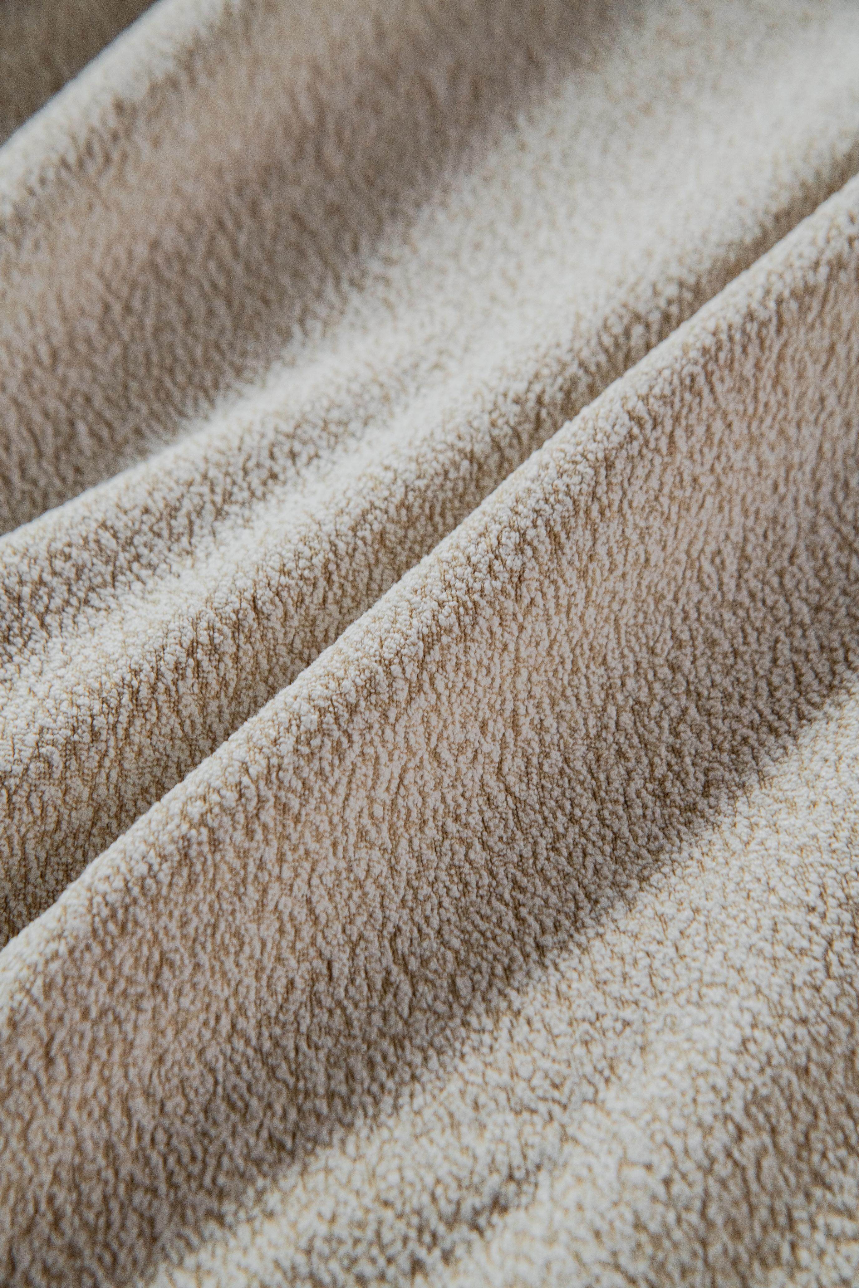 Close-up of the Cozee Cozura Sofa Cover showing thick chenille weave, soft skin-friendly texture, and durable finish.
