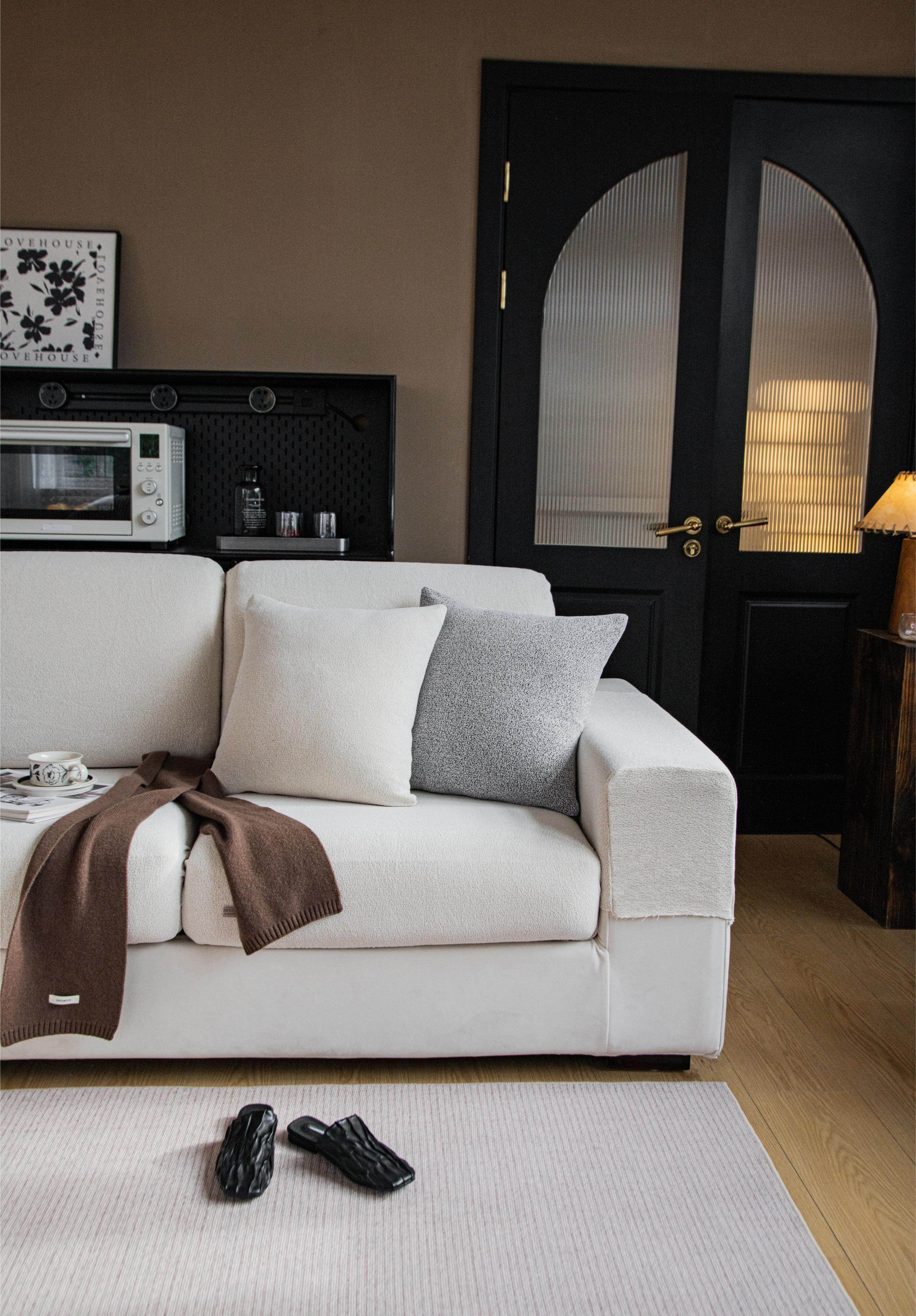 Half view of the Cozee Cozura Sofa Cover, showcasing thick chenille fabric, soft skin-friendly texture, and durable stretch fit for everyday sofa protection.