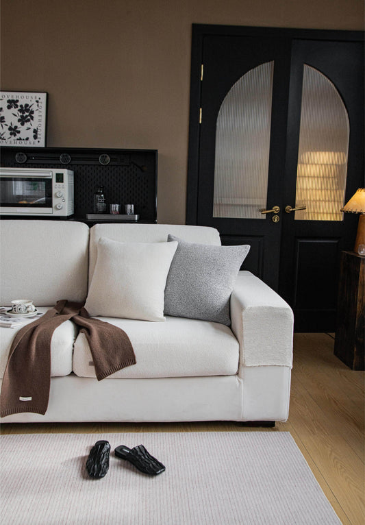 Half view of the Cozee Cozura Sofa Cover, showcasing thick chenille fabric, soft skin-friendly texture, and durable stretch fit for everyday sofa protection.