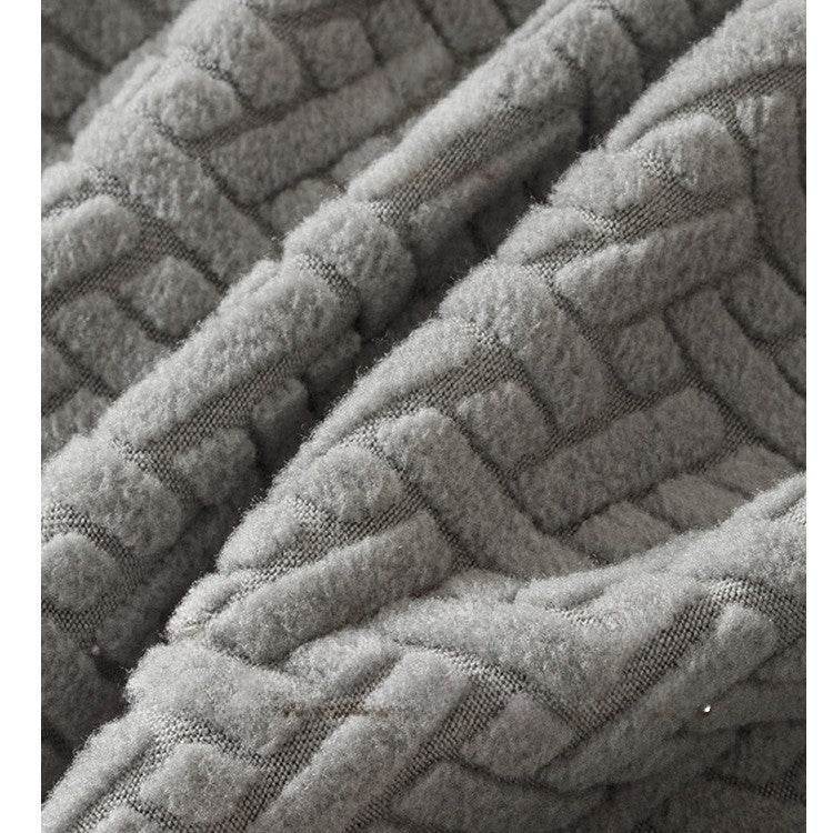 Close-up of gray fabric with a basketweave pattern, highlighting the durable, textured surface and refined finish of the Cozee Elastic Seat Cover