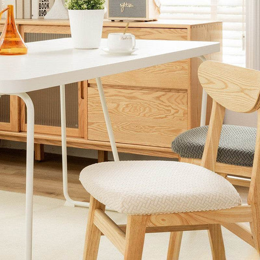 Seat covered with the Cozee Elastic Seat Cover, featuring thick stretch fabric and anti-slip backing for a snug fit on wooden dining chairs or stools, ideal for home, office, or restaurant use