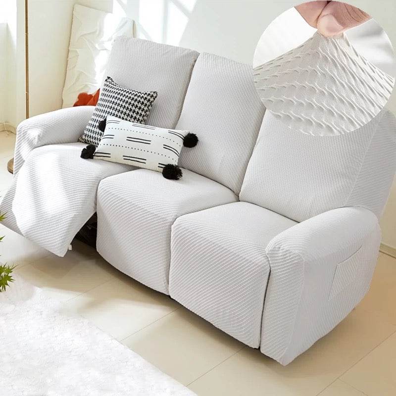 Full view of 3-seater sofa with EverPlush slipcover, showing hand pinching the stretchy, breathable fabric for a snug, flexible fit