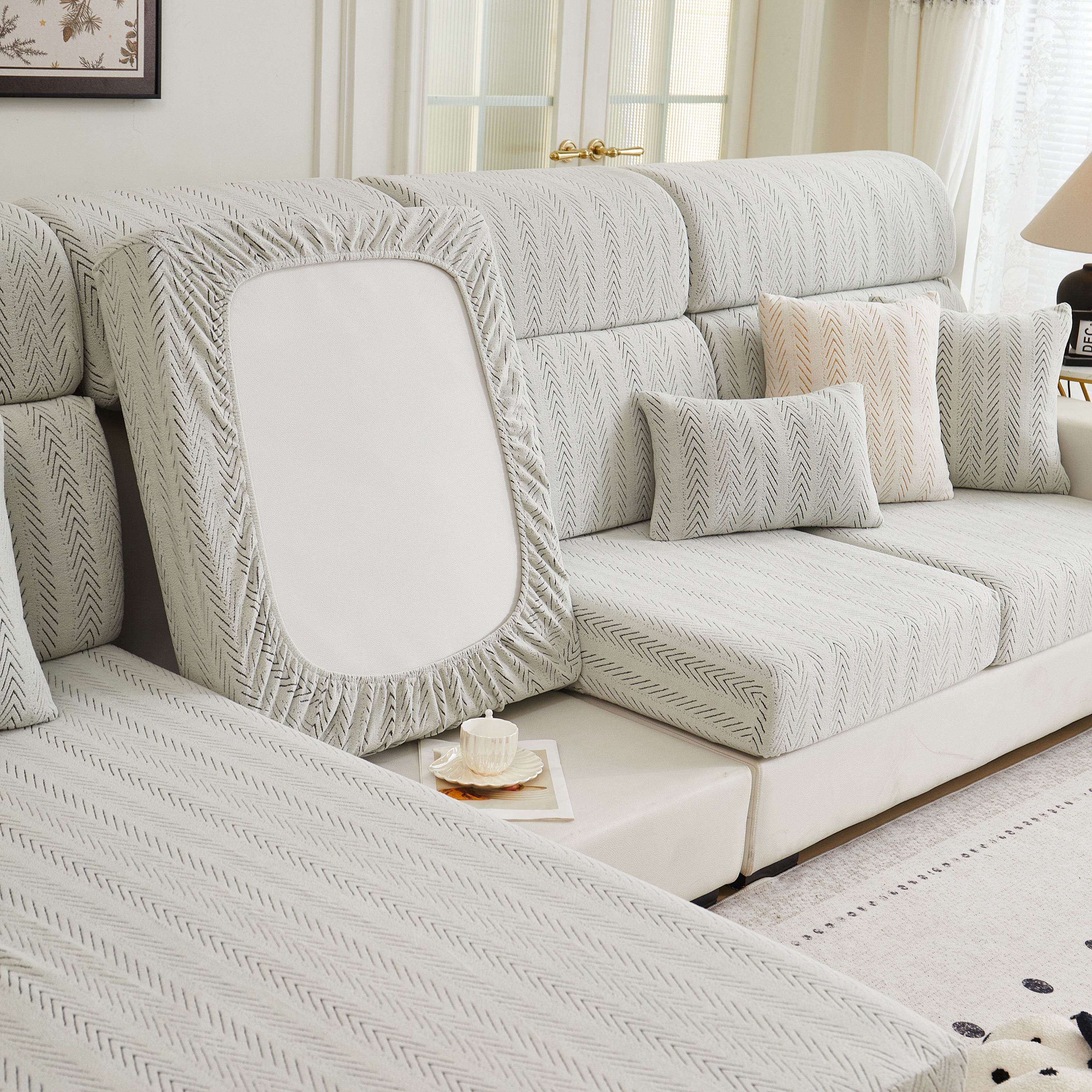 Back view of the Cozee Herringbone Sofa Cover, showing full sofa coverage with a snug stretch fit and durable herringbone fabric for lasting protection.