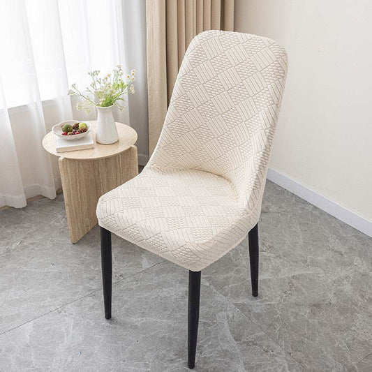 Dining chair covered with the Cozee Jacquard Curved Chair Cover, featuring a refined jacquard texture and flexible stretch fit that hugs curved backs for a sleek, elegant look and everyday protection