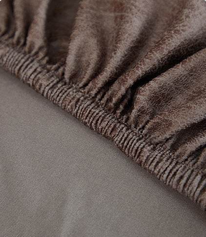Close-up of durable stitching detail on the Cozee Lux recliner slipcover, highlighting quality craftsmanship and long-lasting construction