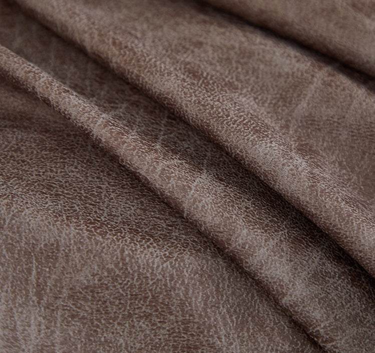 Close-up of soft, textured fabric on the Cozee Lux recliner slipcover, highlighting breathable weave and premium finish