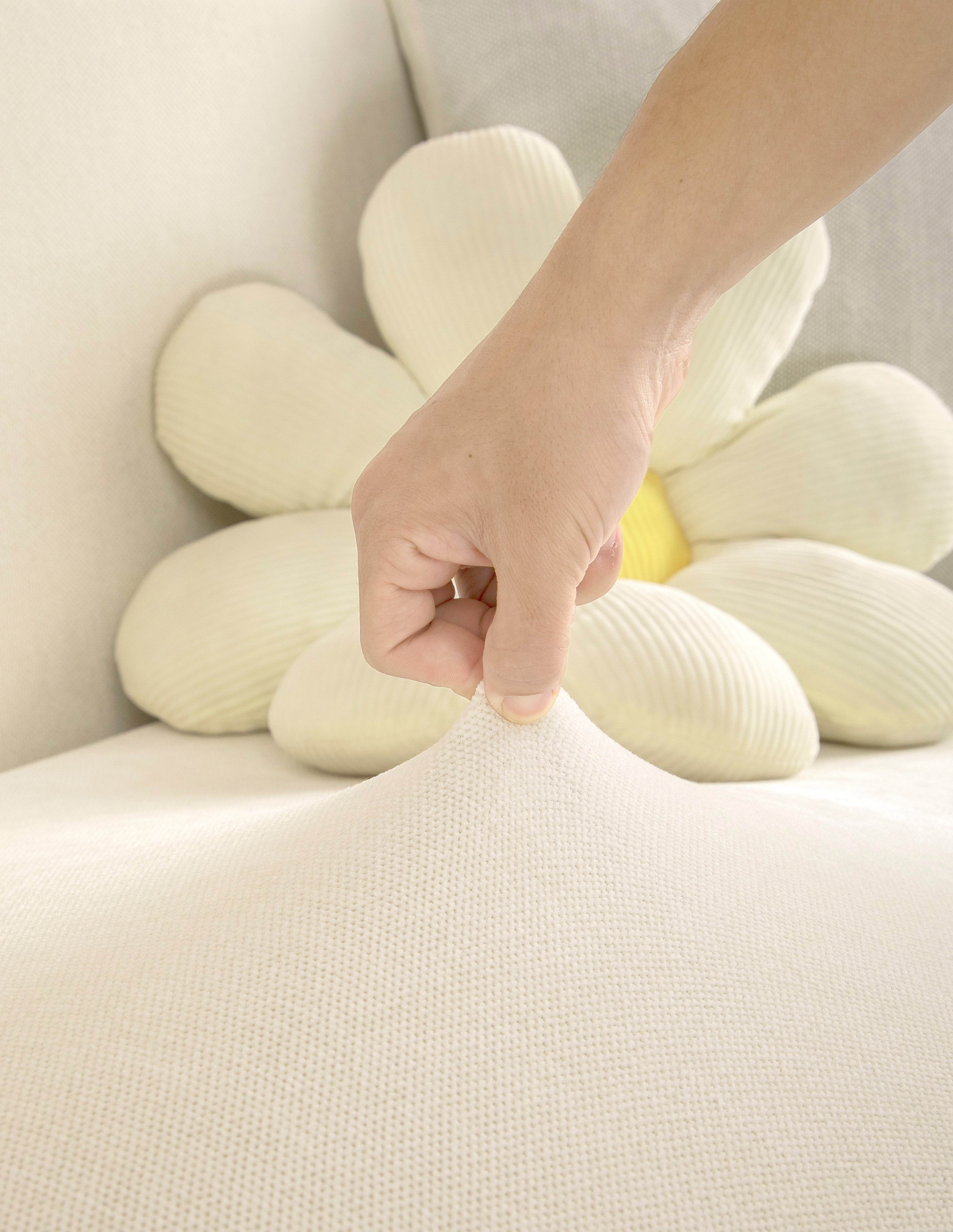 Close-up of plush chenille fabric showing soft, premium texture in cream