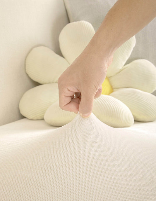 Close-up of plush chenille fabric showing soft, premium texture in cream