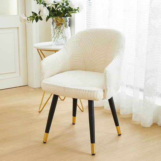 Full coverage chair cover with ultra-soft stretch velvet fabric, designed to fit curved-back chairs with high armrests and featuring an elegant embossed leaf pattern