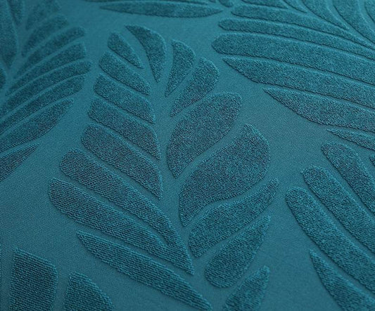 Close-up of textured teal fabric with subtle leaf patterns, highlighting the soft weave and elegant design of the Cozee SoftWeave Skirted Chair Cover