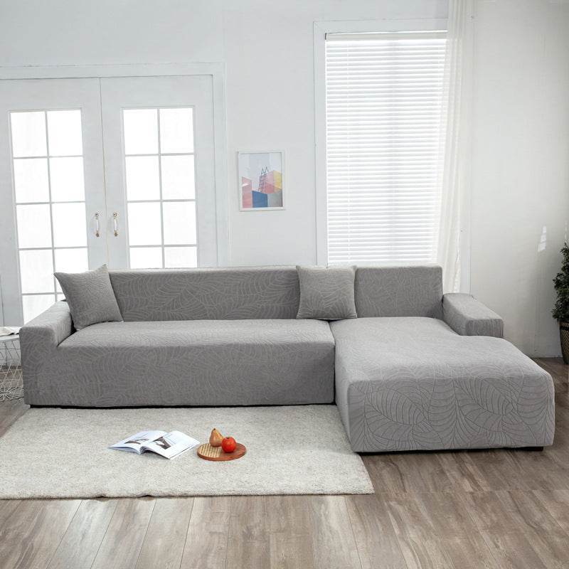 Full view of a sofa fitted with the Cozee SoftWeave Slipcover, featuring soft stretch fabric for a smooth, tailored fit that protects against spills, stains, and daily wear—perfect for busy homes