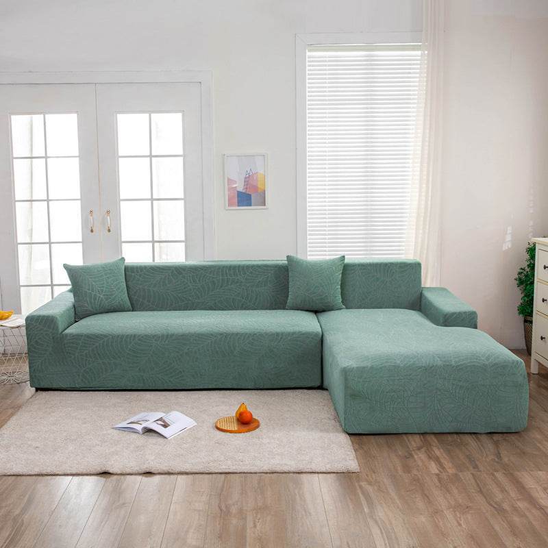 Full view of a sofa fitted with the Cozee SoftWeave Slipcover, featuring soft stretch fabric for a smooth, tailored fit that protects against spills, stains, and daily wear—perfect for busy homes