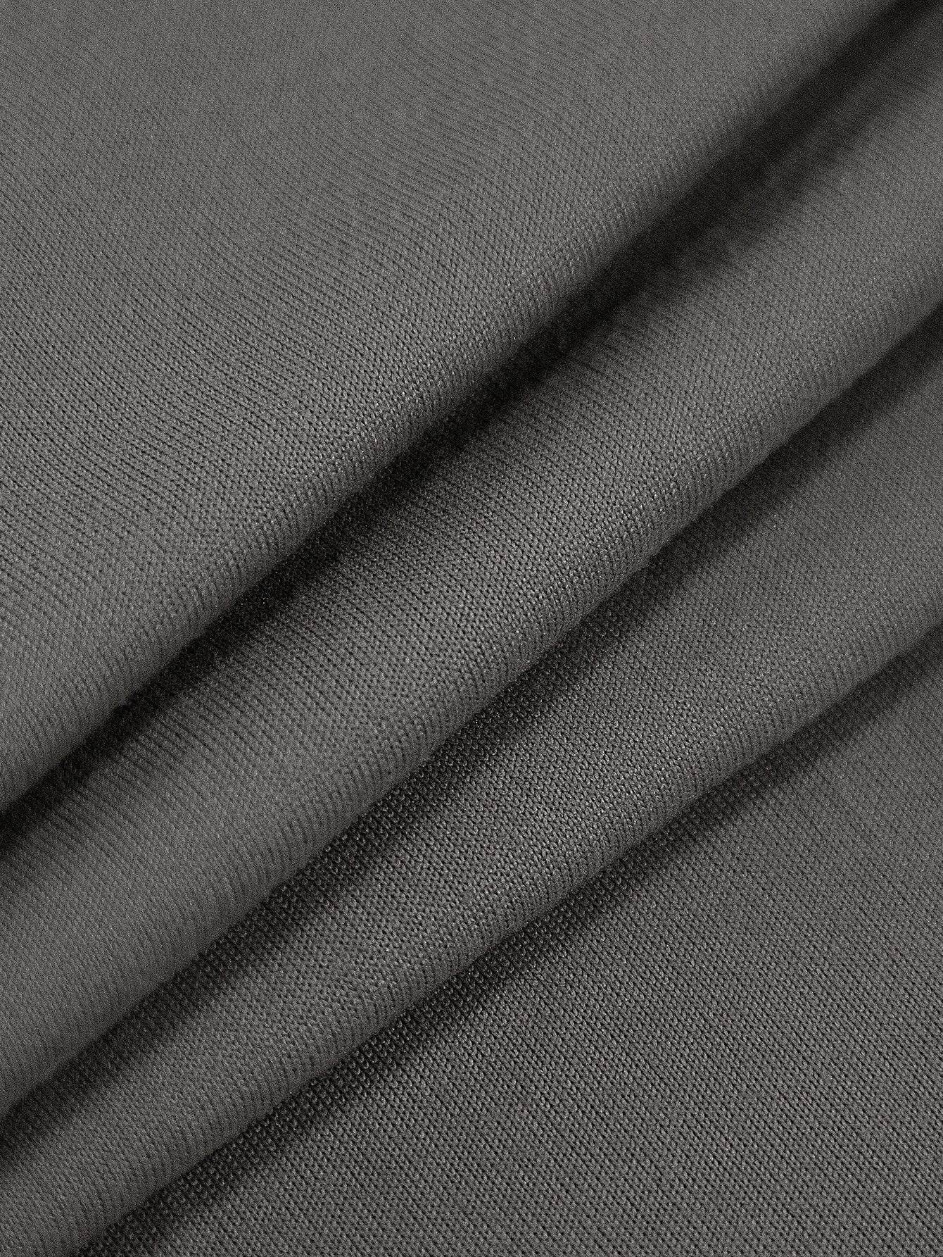 Close-up of the soft, stretchable fabric texture of the Cozee Stretch Fit Chair Cover, highlighting its smooth finish and comfortable, flexible material