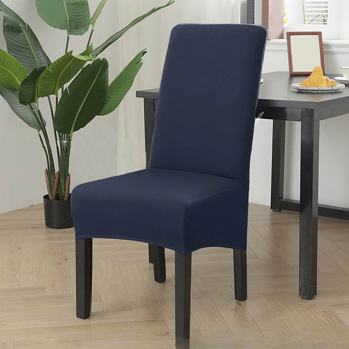 Dining chair fitted with the Cozee Stretch Fit Chair Cover, featuring a smooth, snug fit with soft stretchy fabric that protects against spills, stains, and daily wear