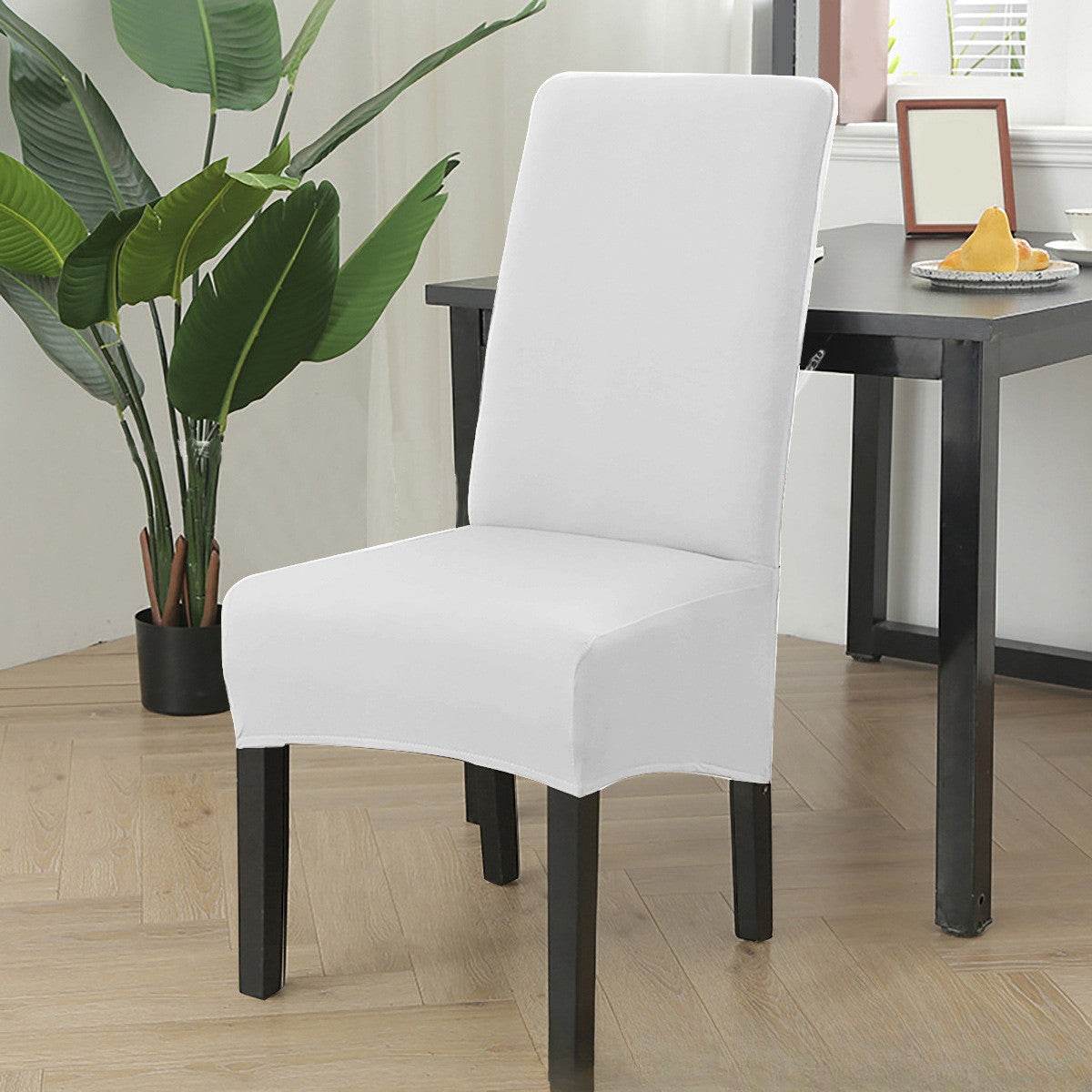 Dining chair fitted with the Cozee Stretch Fit Chair Cover, featuring a smooth, snug fit with soft stretchy fabric that protects against spills, stains, and daily wear