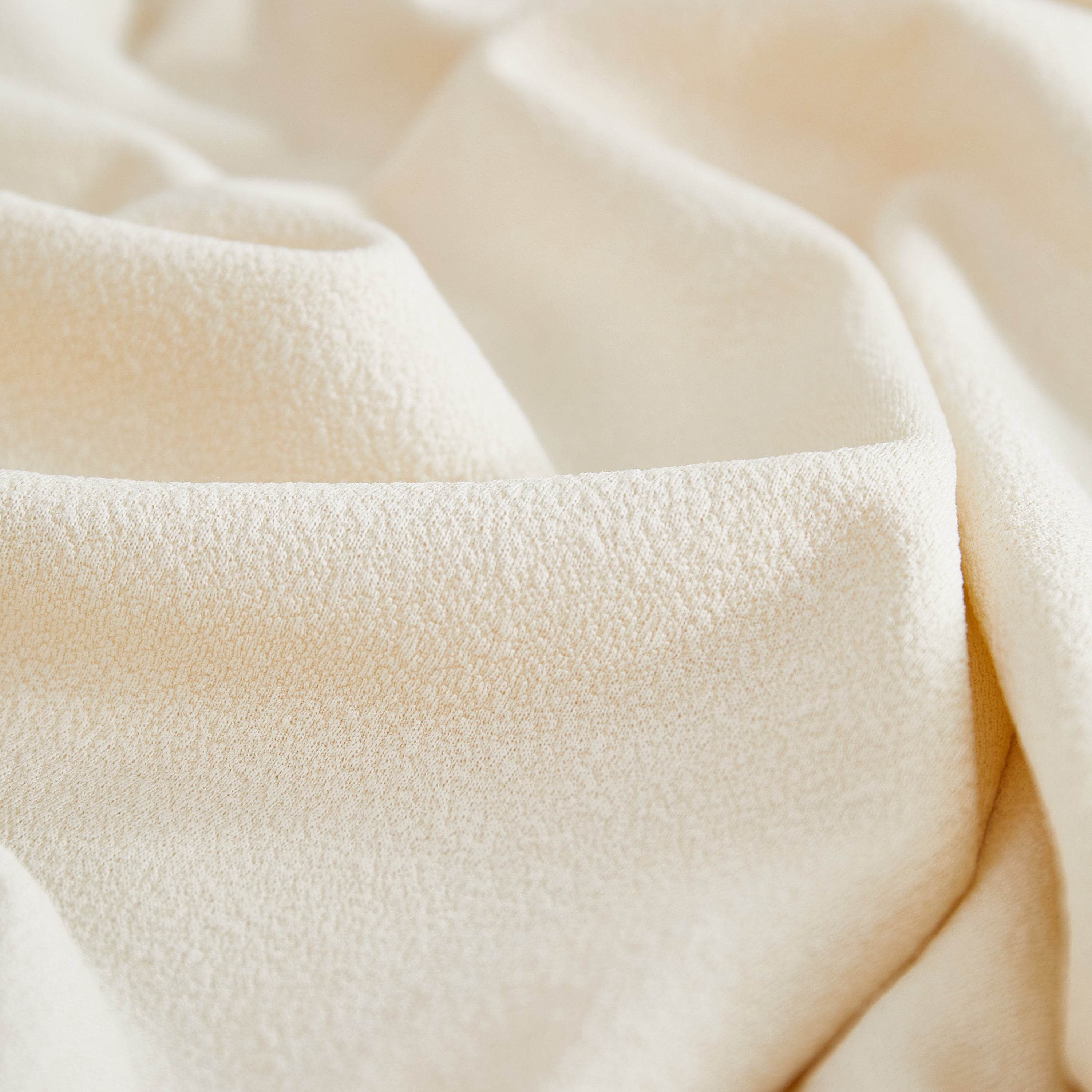 Close-up of cream teddy fleece fabric with a soft, plush texture—ideal for cozy, premium-quality couch covers and sofa covers.