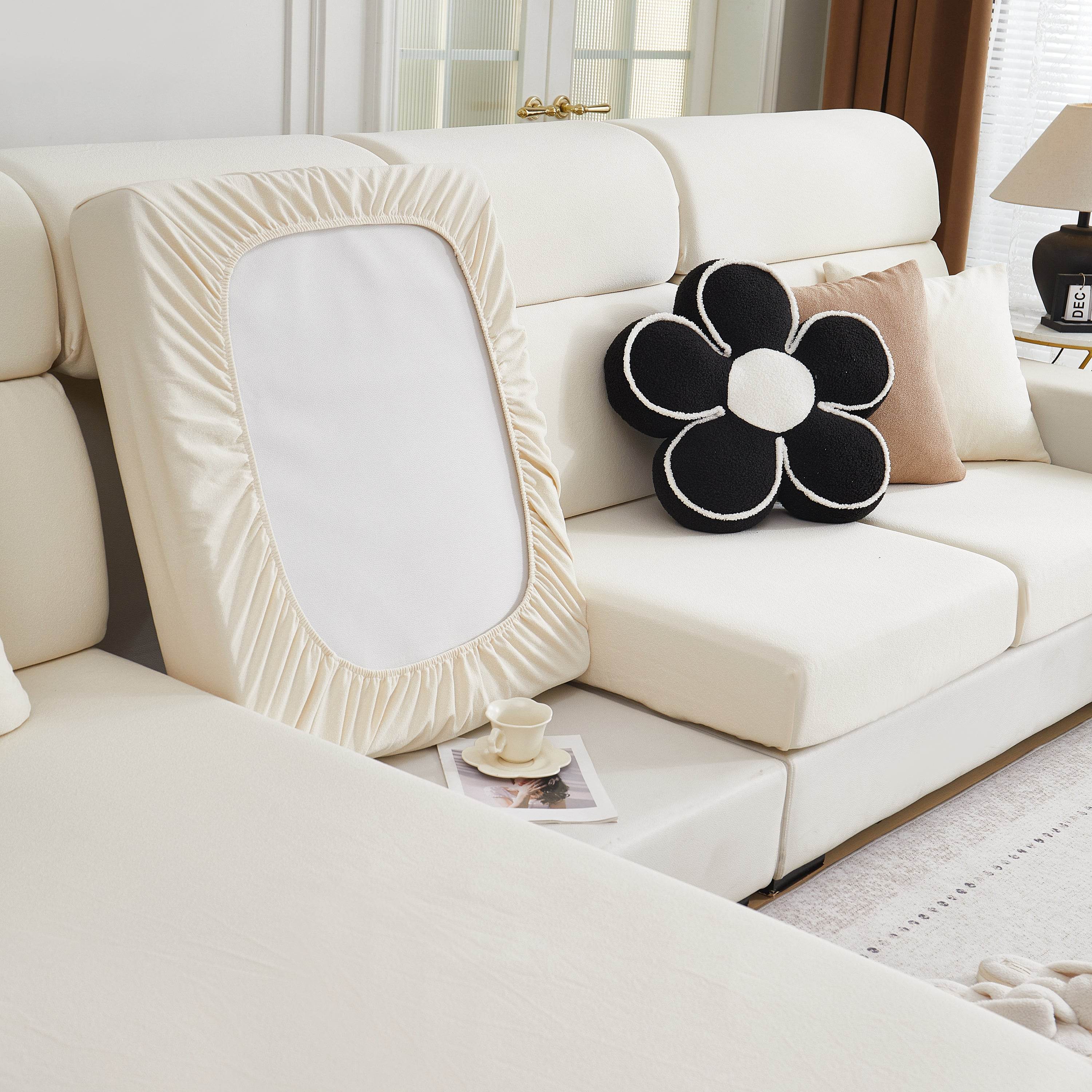 Back view of the Cozee Teddy Plush Sofa Cover on a sofa in a cozy living room setting, highlighting the snug fit and full-coverage design.