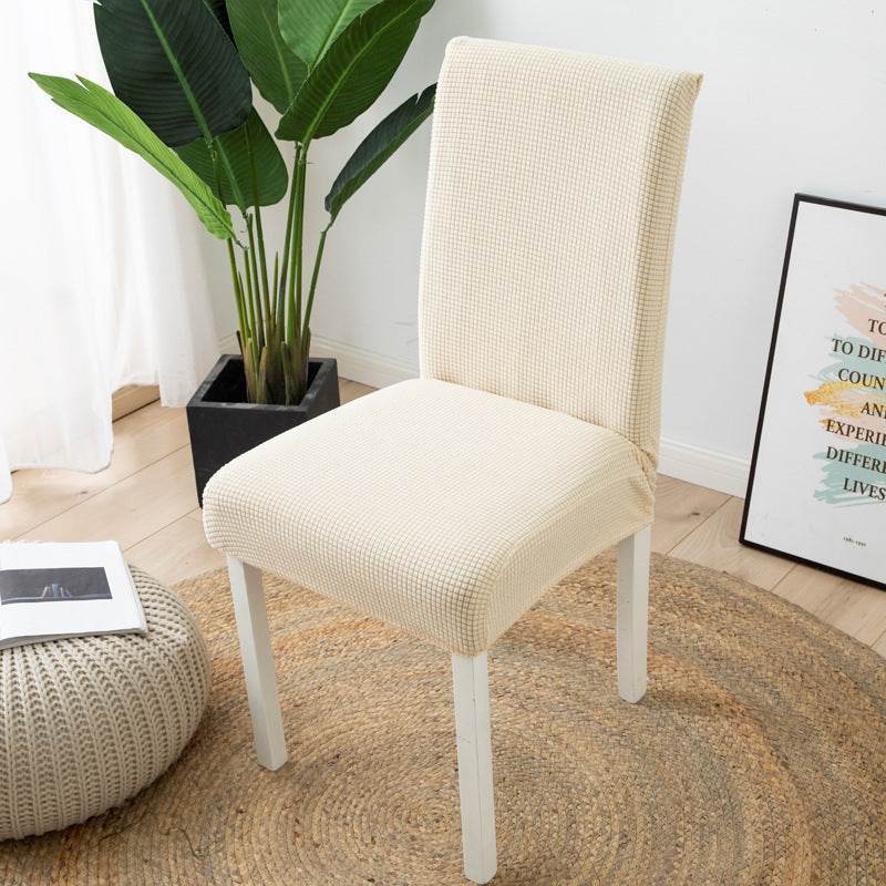 Full view of a chair fitted with the Cozee Timeless Chair Cover, featuring soft, plush fleece fabric and a secure stretch fit that offers full protection against dust, spills, and pet hair