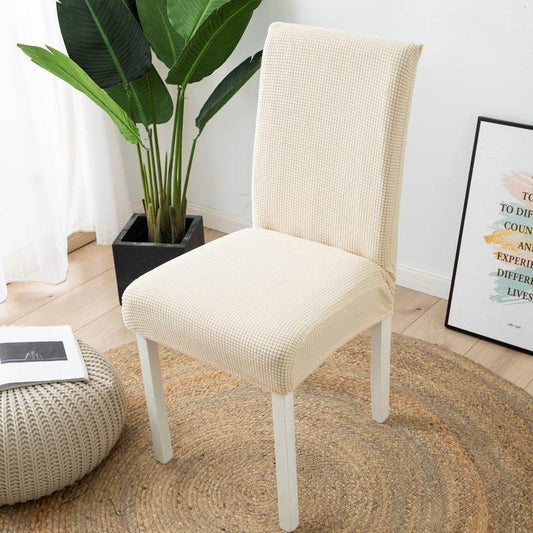 Full view of a chair fitted with the Cozee Timeless Chair Cover, featuring soft, plush fleece fabric and a secure stretch fit that offers full protection against dust, spills, and pet hair