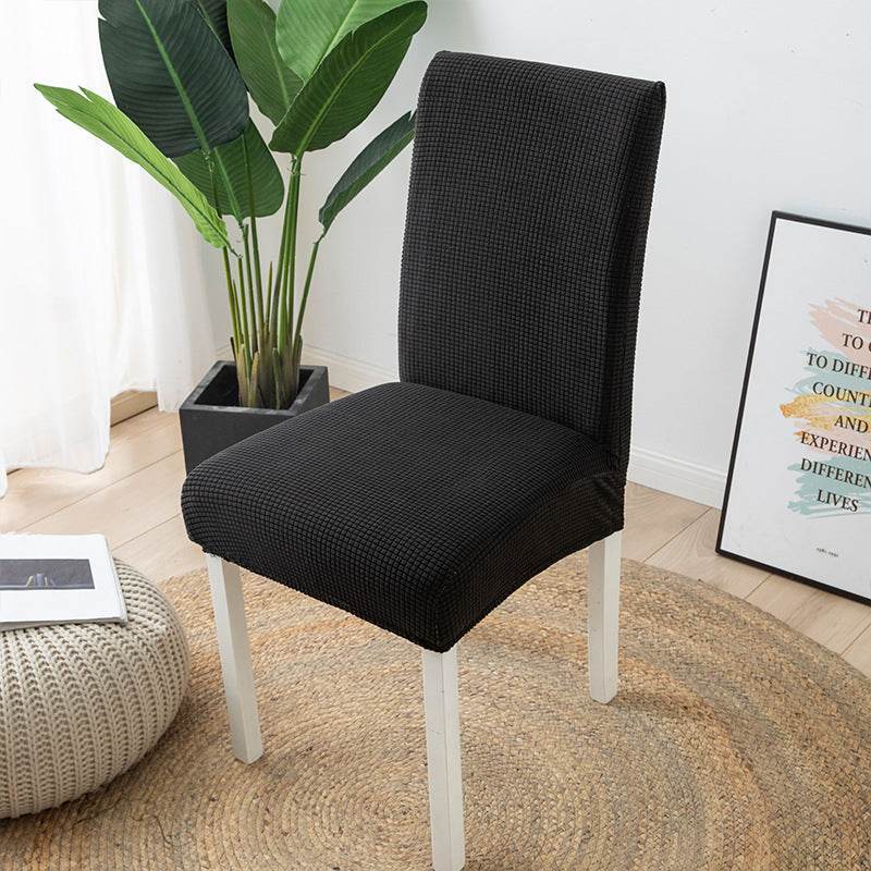 Full view of a chair fitted with the Cozee Timeless Chair Cover, featuring soft, plush fleece fabric and a secure stretch fit that offers full protection against dust, spills, and pet hair