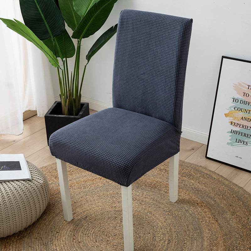 Full view of a chair fitted with the Cozee Timeless Chair Cover, featuring soft, plush fleece fabric and a secure stretch fit that offers full protection against dust, spills, and pet hair