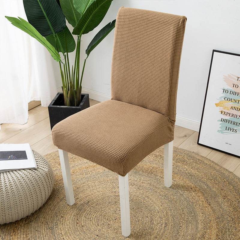 Full view of a chair fitted with the Cozee Timeless Chair Cover, featuring soft, plush fleece fabric and a secure stretch fit that offers full protection against dust, spills, and pet hair