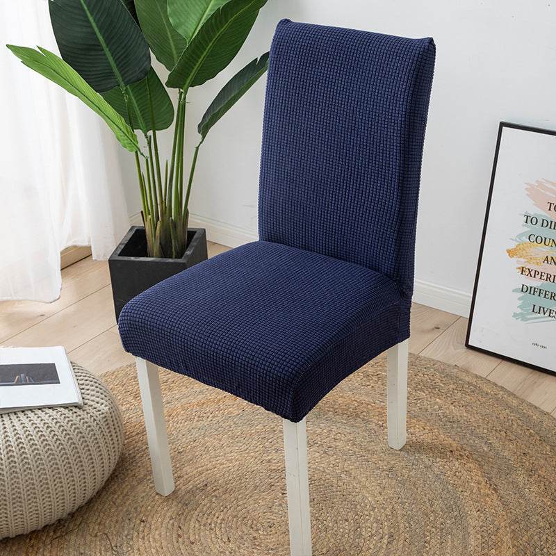 Full view of a chair fitted with the Cozee Timeless Chair Cover, featuring soft, plush fleece fabric and a secure stretch fit that offers full protection against dust, spills, and pet hair
