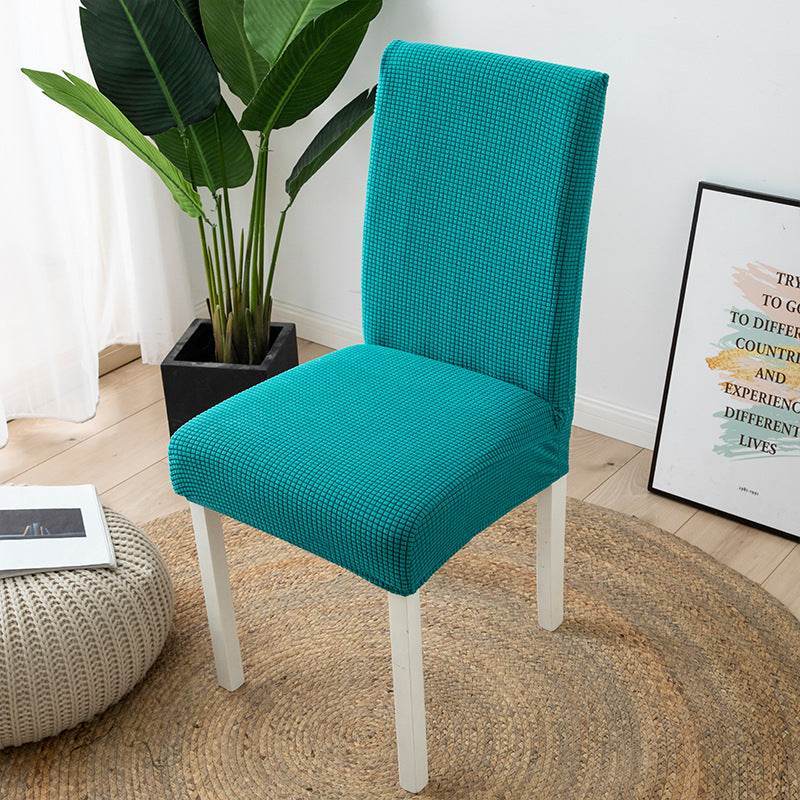Full view of a chair fitted with the Cozee Timeless Chair Cover, featuring soft, plush fleece fabric and a secure stretch fit that offers full protection against dust, spills, and pet hair