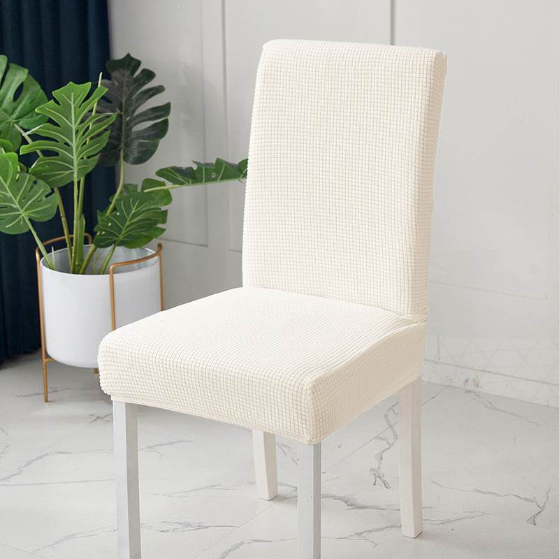 Full view of a chair fitted with the Cozee Timeless Chair Cover, featuring soft, plush fleece fabric and a secure stretch fit that offers full protection against dust, spills, and pet hair
