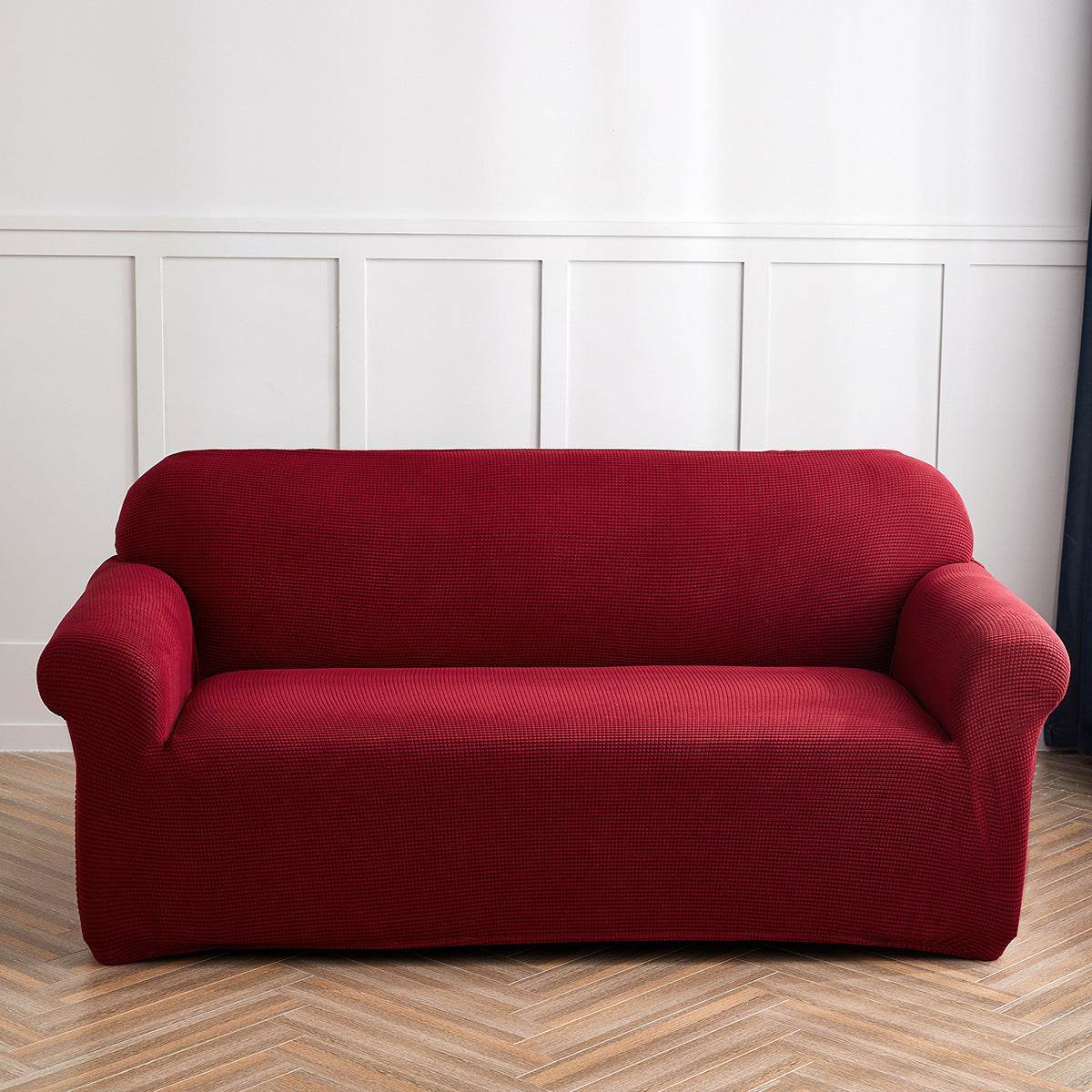 Full view of a sofa covered with the Cozee Timeless Slipcover, styled with matching cushions in a cozy living room setting, showcasing the soft plush fabric and snug fit for a warm, inviting look