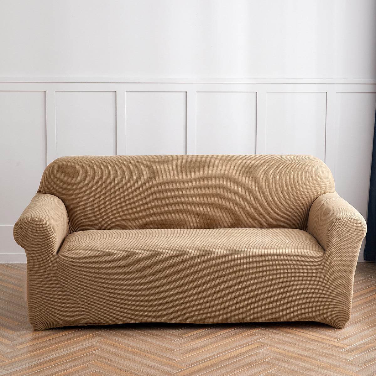 Sofa fitted with the Cozee Timeless Slipcover, featuring ultra-soft plush fleece fabric and a high-stretch, snug fit that offers cozy comfort and full coverage protection from spills, dust, and pet hair