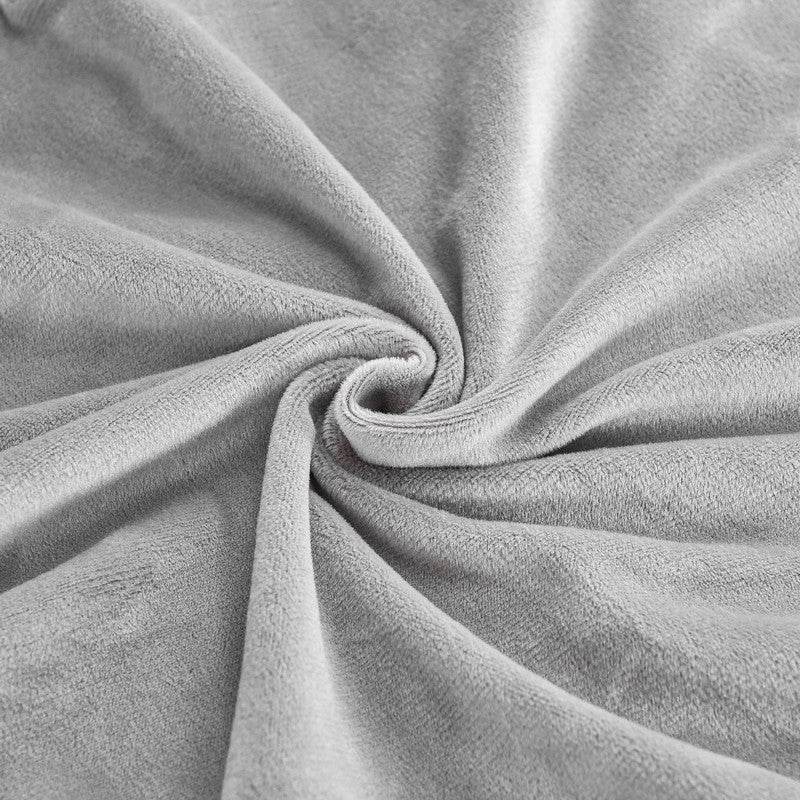 Close-up of gray microfiber fleece fabric with natural folds, showcasing the soft texture and flexible drape of the Cozee Ultra Soft Plush Chair Cover