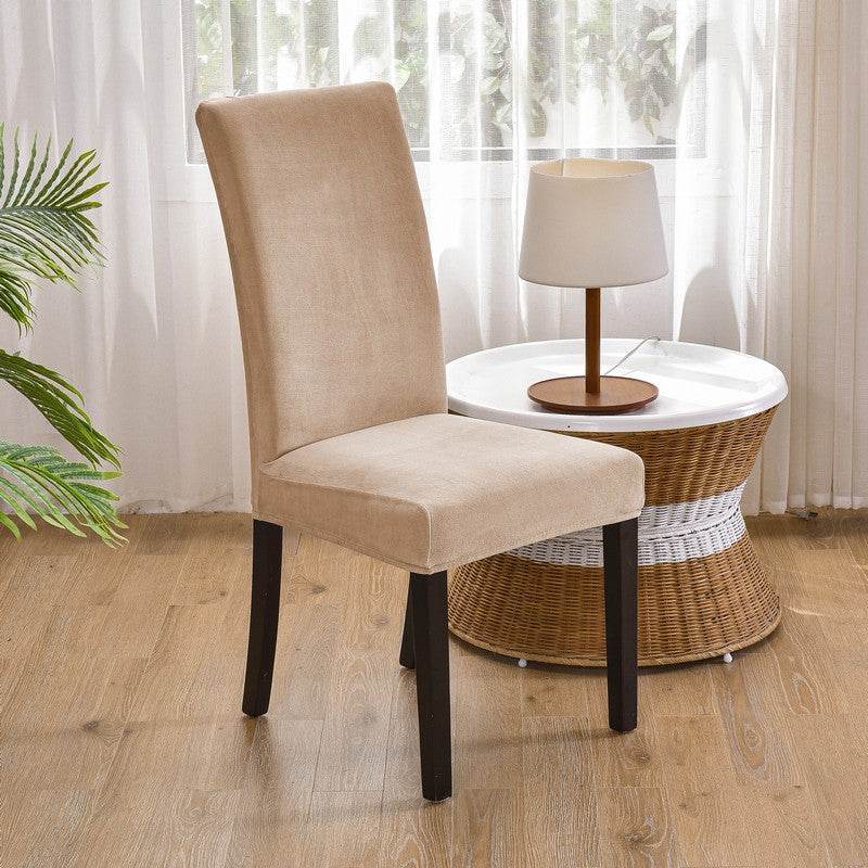 Full view of a chair covered with the Cozee Ultra Soft Plush Chair Cover, featuring a soft microfiber fleece fabric and snug stretch fit that protects against stains, spills, and daily wear