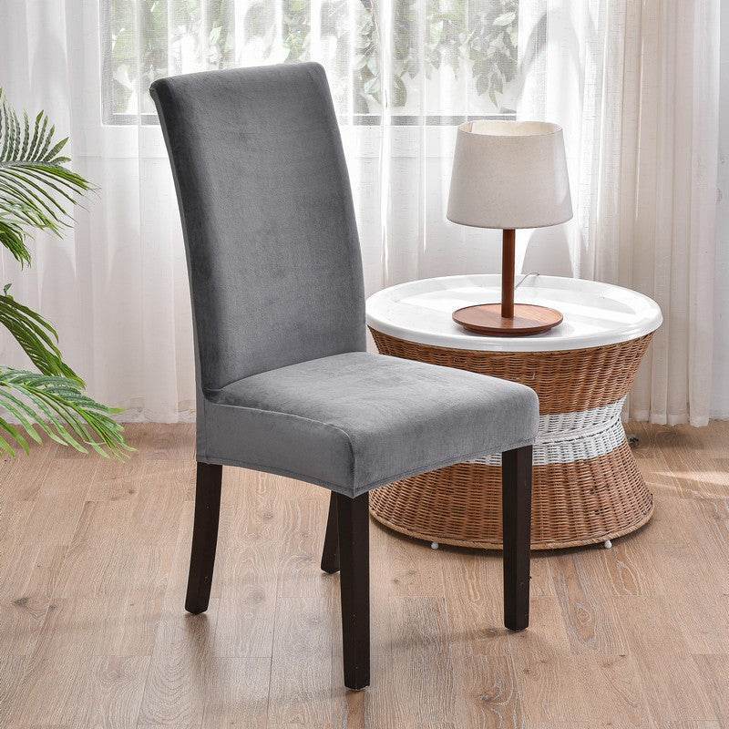 Full view of a chair covered with the Cozee Ultra Soft Plush Chair Cover, featuring a soft microfiber fleece fabric and snug stretch fit that protects against stains, spills, and daily wear