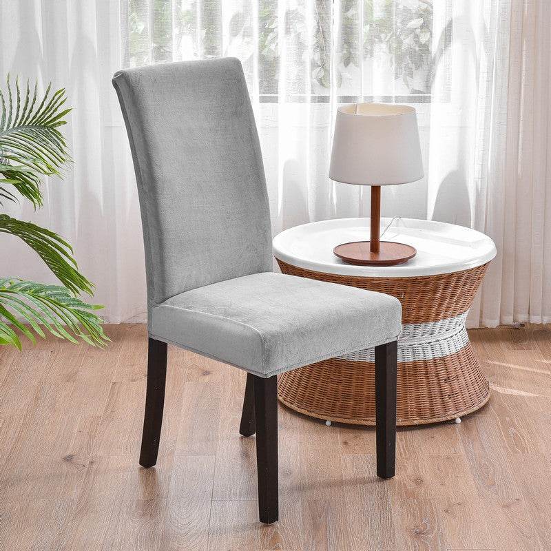 Full view of a chair covered with the Cozee Ultra Soft Plush Chair Cover, featuring a soft microfiber fleece fabric and snug stretch fit that protects against stains, spills, and daily wear
