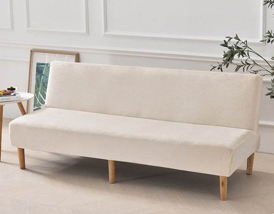 Full view of futon covered with the Cozee Ultra Soft Plush Slipcover, featuring a smooth, tailored fit with cozy microfiber fleece fabric for comfort and all-around protection