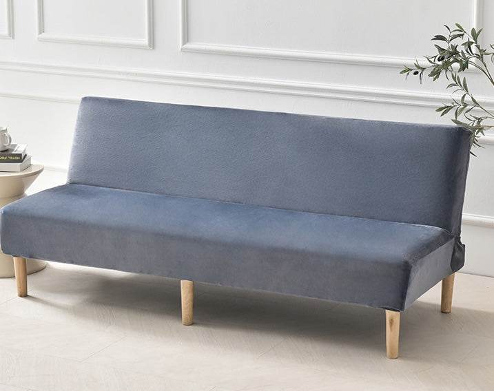 Full view of futon covered with the Cozee Ultra Soft Plush Slipcover, featuring a smooth, tailored fit with cozy microfiber fleece fabric for comfort and all-around protection