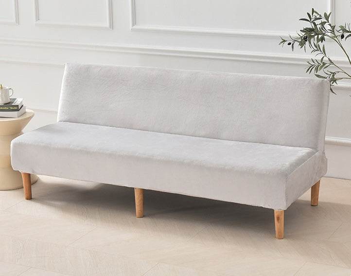 Full view of futon covered with the Cozee Ultra Soft Plush Slipcover, featuring a smooth, tailored fit with cozy microfiber fleece fabric for comfort and all-around protection