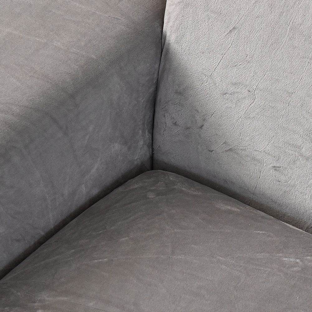 Close-up of soft, textured plush fabric shown at a corner, highlighting the smooth finish and flexible fit of the Cozee Ultra Soft Plush Slipcover