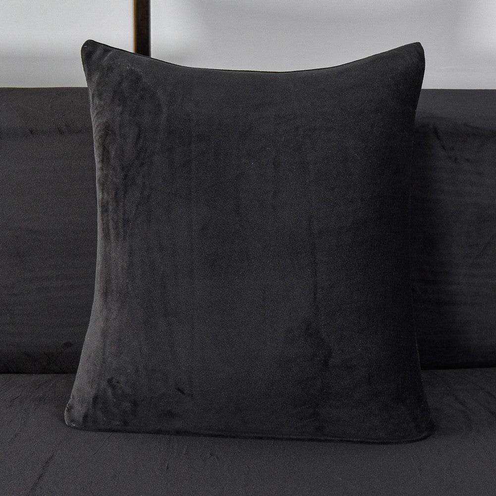 Full view of a sofa pillow covered in plush, velvety fabric, showcasing the soft texture and coordinated design of the Cozee Ultra Soft Plush Slipcover set