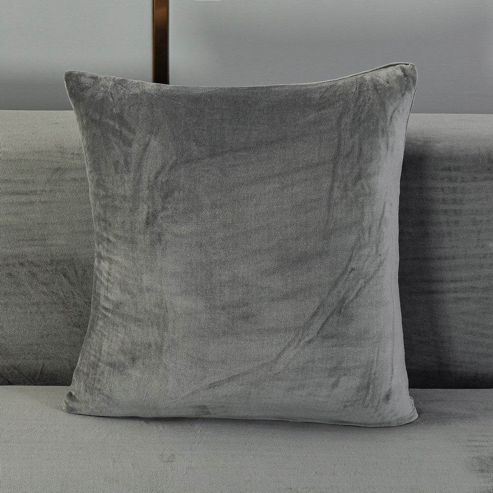 Full view of a sofa pillow covered in plush, velvety fabric, showcasing the soft texture and coordinated design of the Cozee Ultra Soft Plush Slipcover set