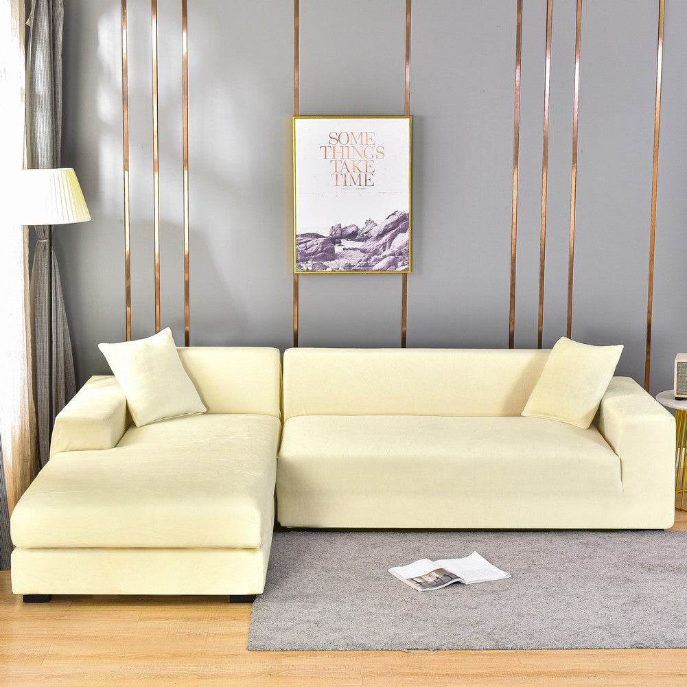 Sofa wrapped in the Cozee Ultra Soft Plush Slipcover, featuring velvety fabric and a snug 4-way stretch fit that offers full coverage and protection from spills, pet hair, and daily wear